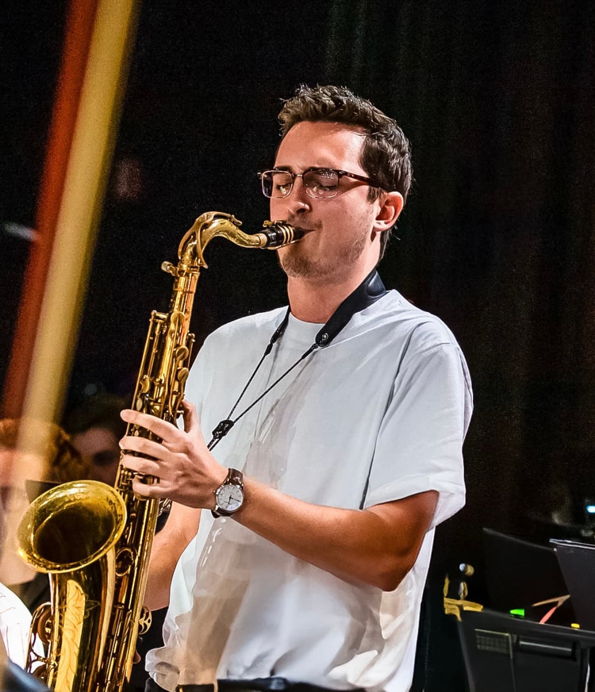 Mario playing saxophone on stage